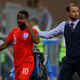 Gareth Southgate walks off Raheem Sterling after subbing him out against Tunisia.